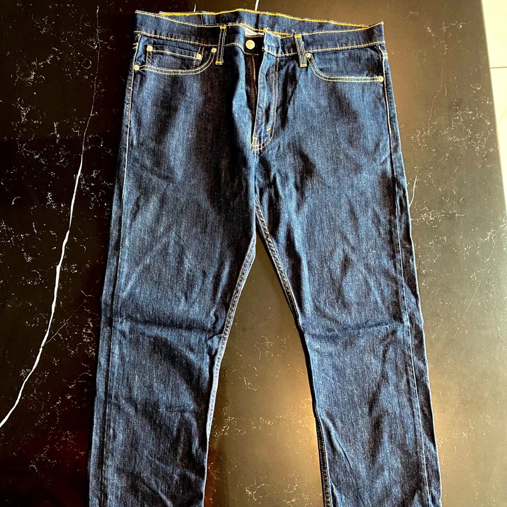 Levi’s 513, dark denim wash. Worn less than 5 times. 34x32
